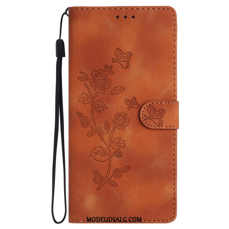 Flip Cover iPhone 16 Trykte Blomster Med Rem